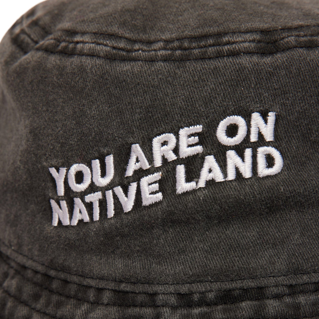 'YOU ARE ON NATIVE LAND' BUCKET HAT
